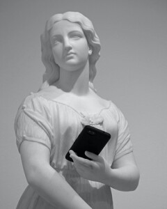 cellphone and statue